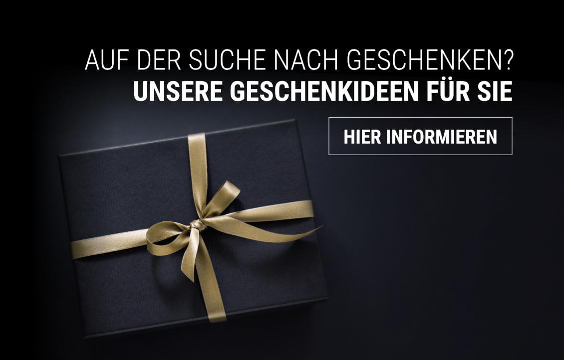 Eine stilvolle Geschenkpackung mit goldener Schleife